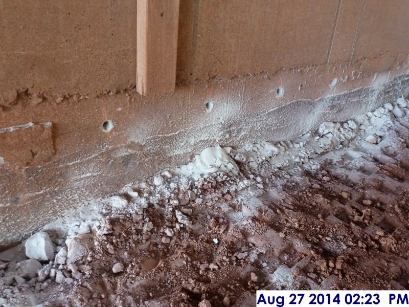 Drilled holes at Elev. 5,6 for the rebar prepping for the slab on grade Facing West (800x600)